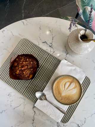 Coffee and vegan muffin at AM Coffee Studio