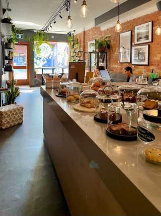 Coffee counter with lots of pastries at AM Coffee Studio