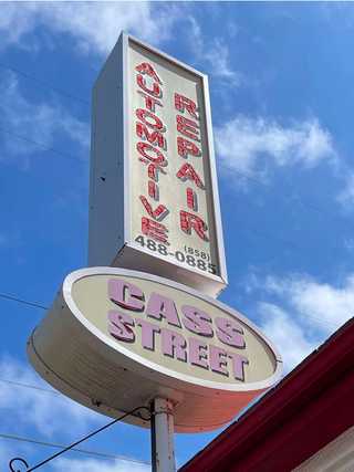 A vintage car repair shop sign at Pacific Beach