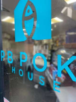 Close up of poke restaurant windows at Pacific Beach