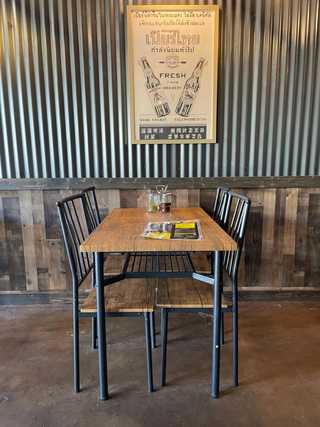 A rustic metal table at SOI PB Thai restaurant in San Diego