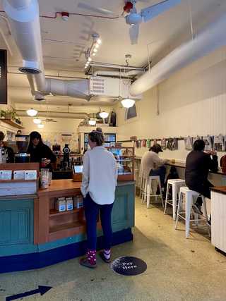 Coffee counter and seating at Analog Coffee