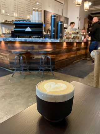 Coffee served in a rustic cup at Arvo
