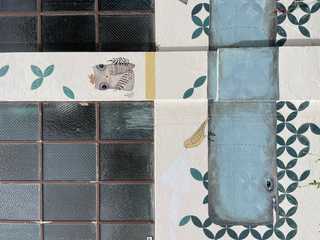 A close up of a bee painted on a industrial house