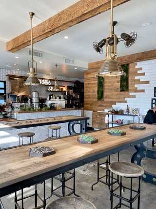 A long communal table at Better Buzz Coffee at Pacific Beach