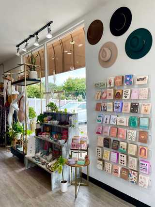 An array of postcards in a lifestyle shop at Bird Rock