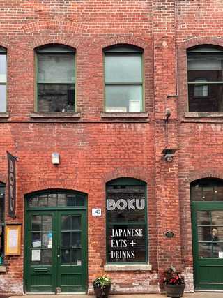 The red brick facade of a Japanese restaurant