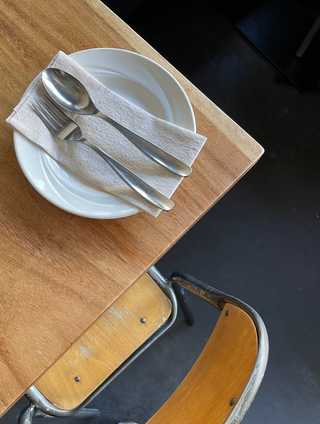 Rustic chairs and cutlery at Burma Love