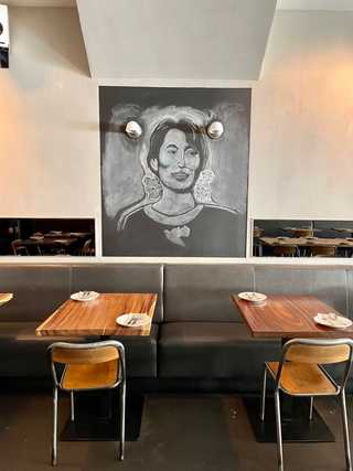 Tables and art work at Burma Love