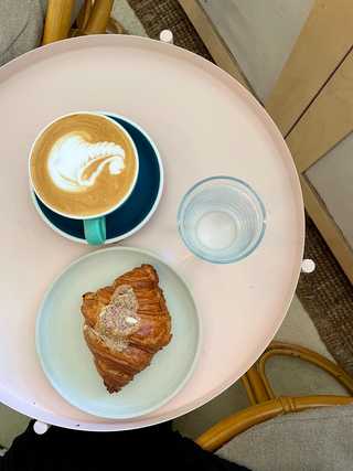Coffee and almond croissant at Carbonic Coffee