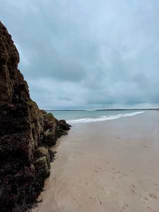 A closeup of riocky St Catherine and waves