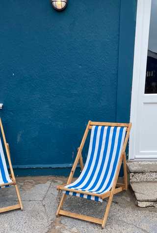 A closeup of blue sunchairs