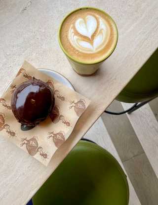 Coffee and doughnut at Dodo Bird Donuts at Bird Rock neighbourhood