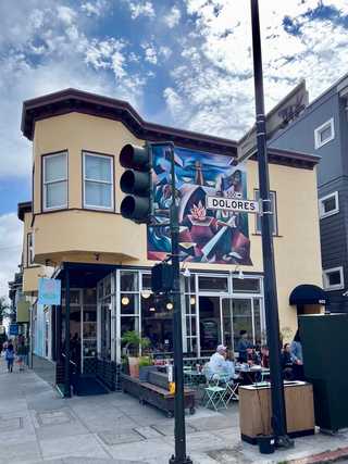 A sunny outdoor terrace of Dolores Park Cafe