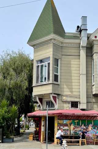Patrons sitting outside of El Paraiso Cafe