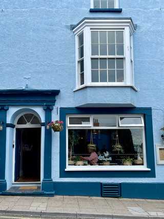A blue restaurant facade in Tenby