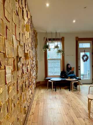 A girl reading in a quiet corner at Fika