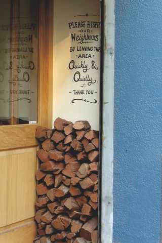 People sitting in the sun outside a coffee shop