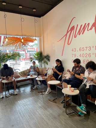 Patrons relaxing and reading at Found Coffee