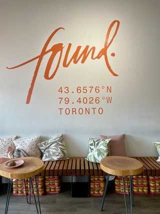 A wall mural with coordinates to Found Coffee