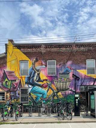 Bicycles against a graffiti of a cycling fox