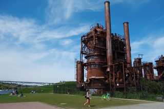 People hanging out around an old gasification park at Gas Works Park