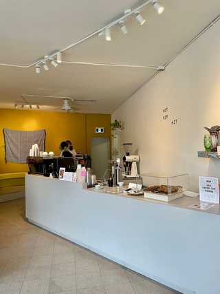 Simplistic white coffee counter at Hamers Coffee