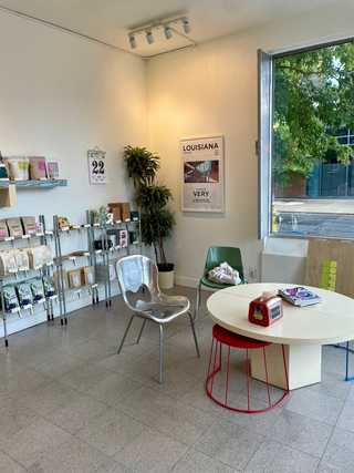 A casual corner with mismatched arty furniture at Hamers Coffee