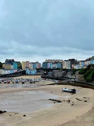 Tenby harbour overlooked by colourful houses