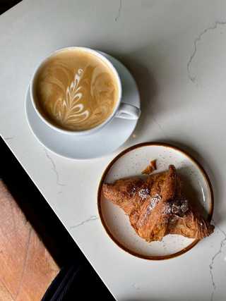 Coffee and croissant at La Clochette in San Diego