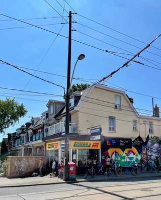 A local convenience store next to residential houses