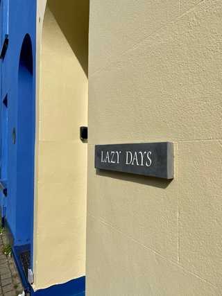 A sign saying lazy days
