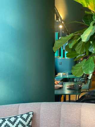 A retro teal wall in the breakfast room