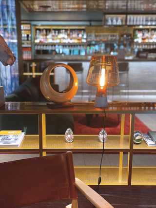 A close up of a lobby lights and armchairs