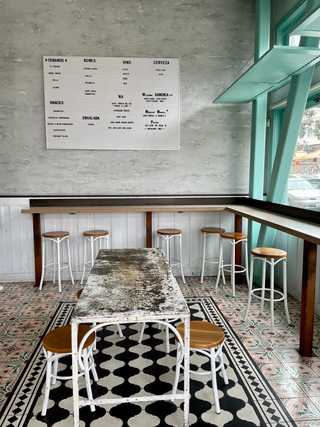 A simple menu on the wall at Media Noche