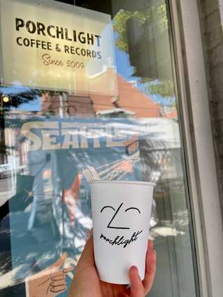 A minimalist, funny take away cup at Porchlight Coffee
