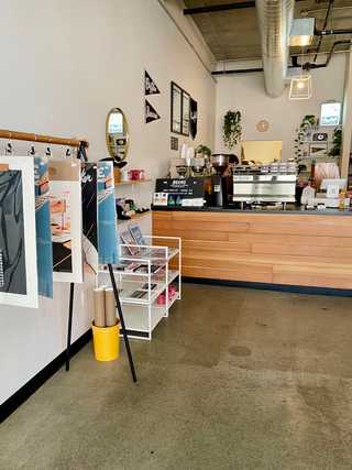 Posters and other merchandise at Porchlight Coffee
