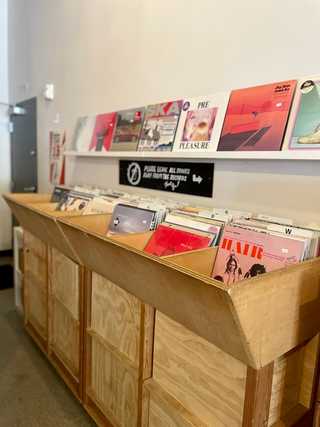 A collection of vinyls sold at Porchlight Coffee