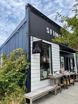 A front of a cute wooden gift shop