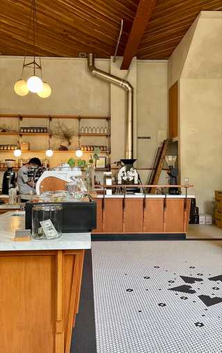 Barista busy making coffees at Sightglass Coffee