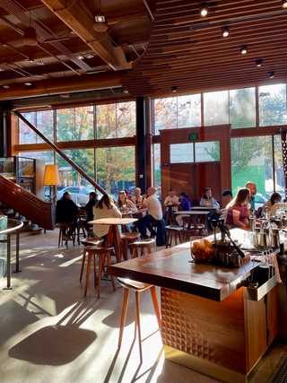 Ample seating around a coffee bar at Starbucks Reserve