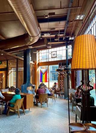 Cosy lounge area with armchairs and log burners at Starbucks Reserve