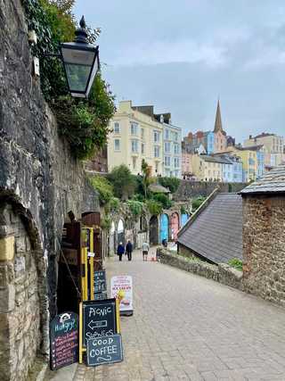 Entrance to a coffee shop on a winding lane
