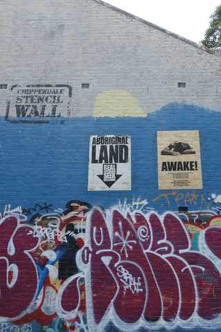 People sitting in the sun outside a coffee shop