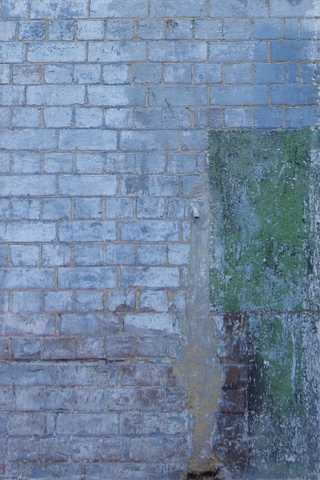 People sitting in the sun outside a coffee shop