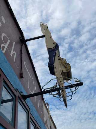 A vintage sign of a female diver