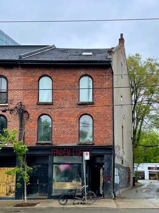 A local cafe in a humble looking red brick house