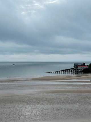 A calm picture of a quiet Tenby pier