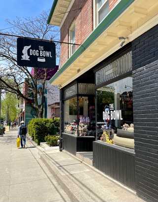A black store front of a pet store