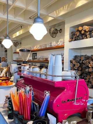 A vibrant pink coffee machine